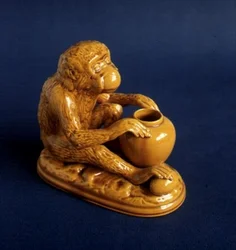 Burmantofts Faience figure of a monkey
